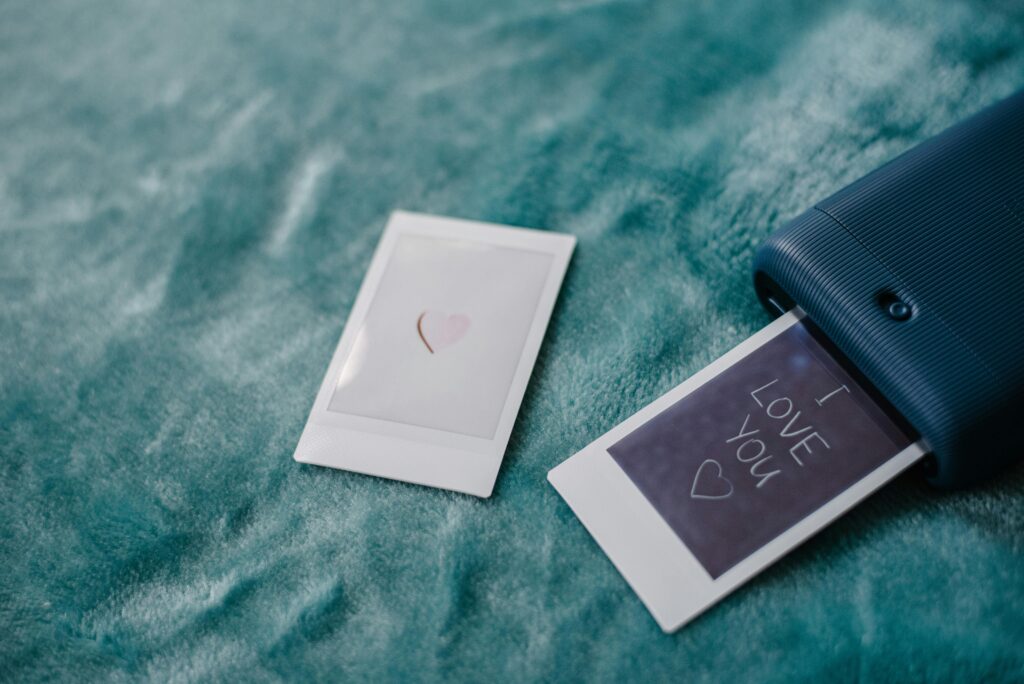 Instant photo printer creating a romantic I love you photo